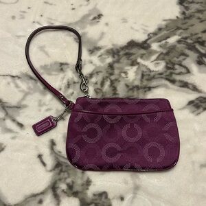 purple coach signature print wristlet